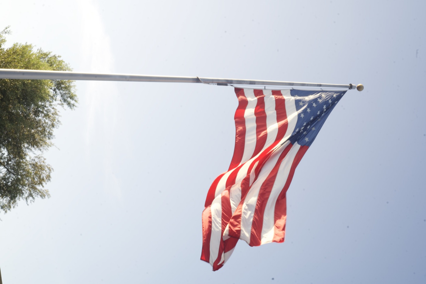 The American flag flying over the festival grounds.